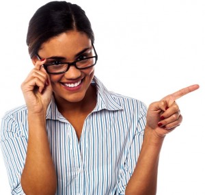 Woman adjusting her spectacles and pointing away